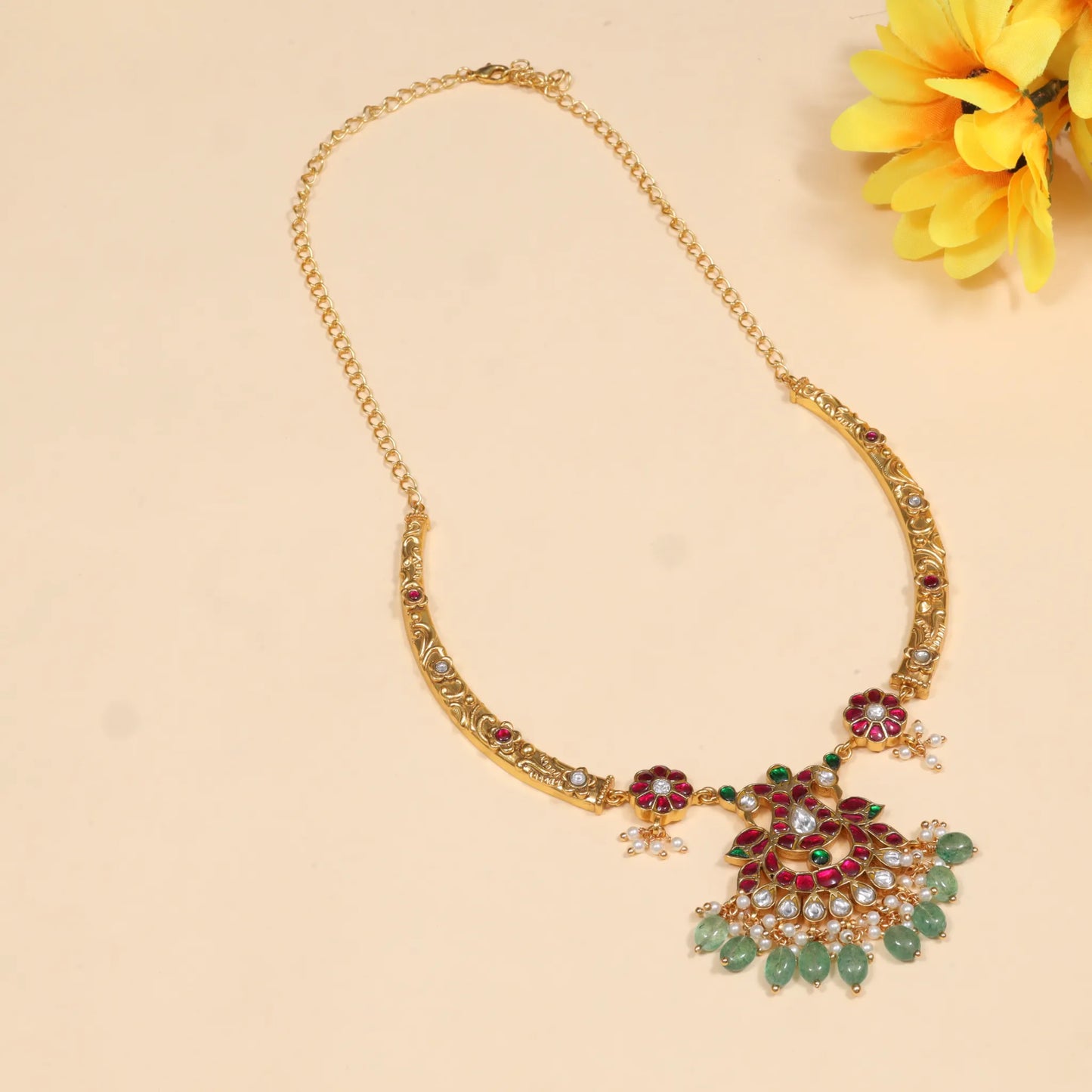 Opulent Designer Jadau Kundan Hasli Necklace with Green Emerald Hangings